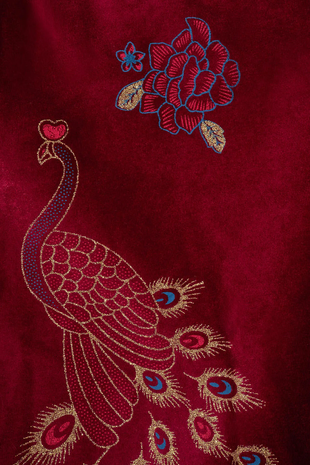 Peacock adorned cape in red